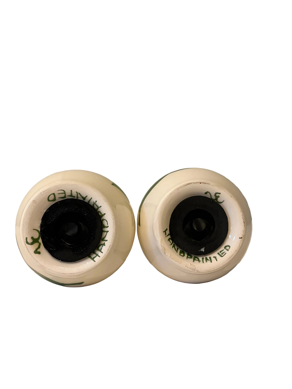 Bases of the tulip shakers showing HANDPAINTED markings and two stoppers
