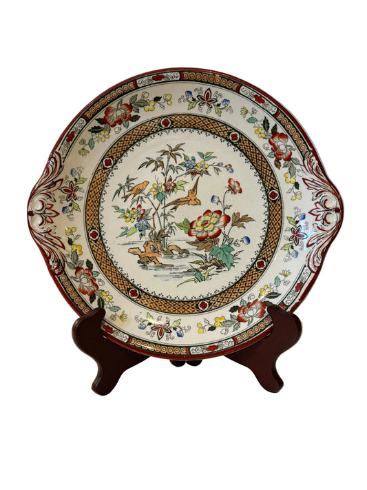 Vintage floral and bird plate with side handles, front view