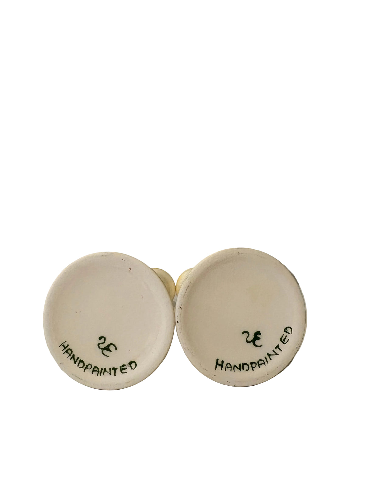 Undersides of the tulip candlesticks marked HANDPAINTED