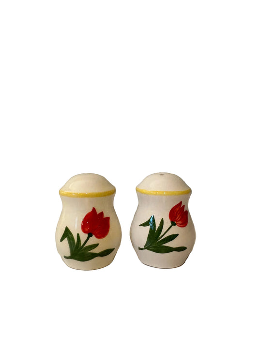 Matching tulip salt and pepper shakers with red flowers and yellow rim accents